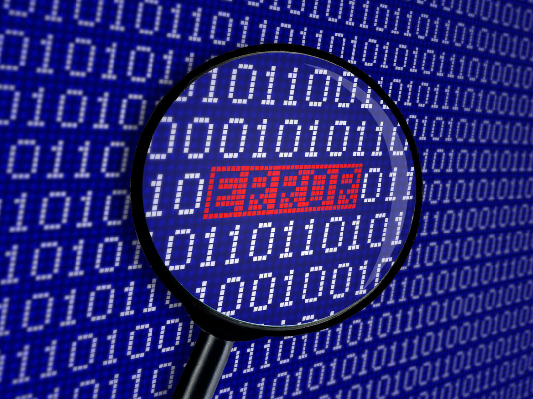Magnifying glass over an error in binary code leads to problems that could have been fixed with software liability insurance.