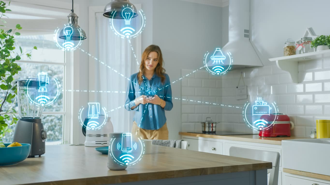 A woman in her kitchen with IoT devices overlayed