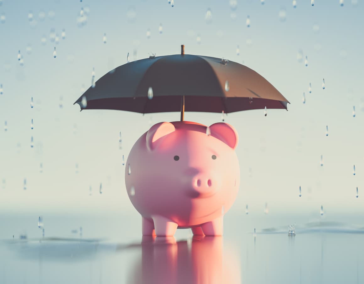 A piggy bank underneath an umbrella signifies umbrella insurance