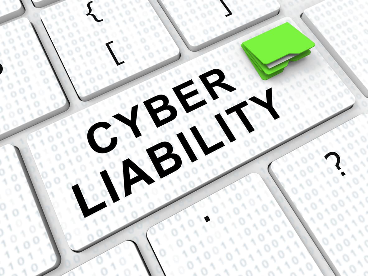 A computer key with the words cyber liability; cyber liability insurance is essential for small businesses